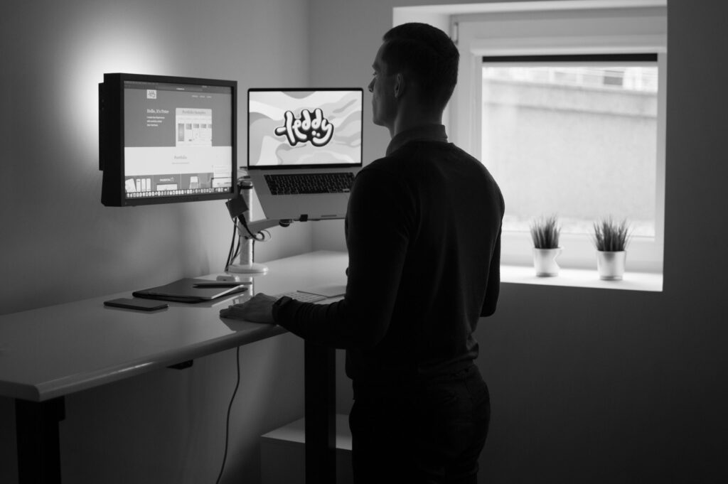 UX Designer working at stand up desk